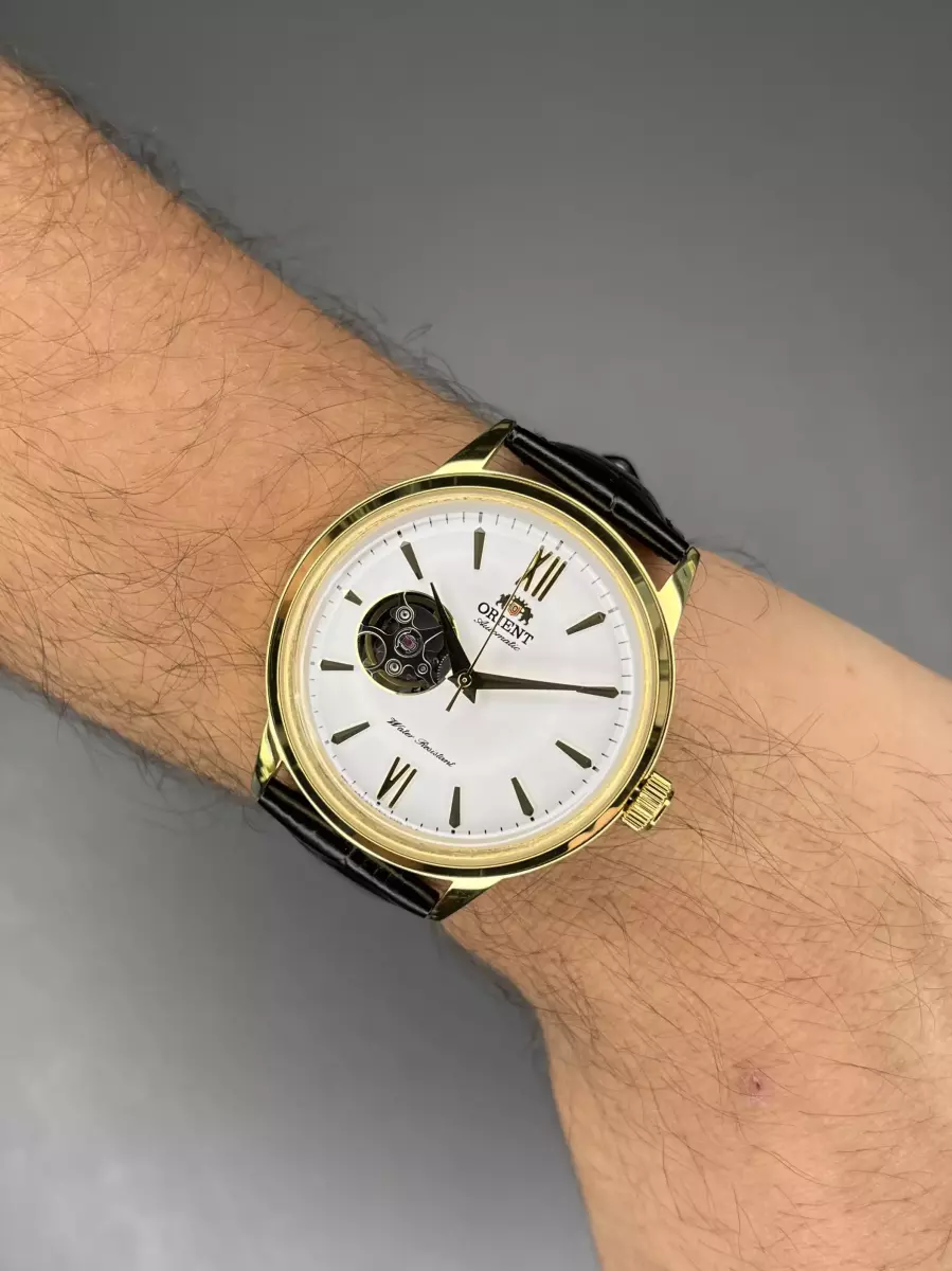 ساعت مچی اورینت اوپن هارت بند چرمی مشکی قاب طلایی Orient