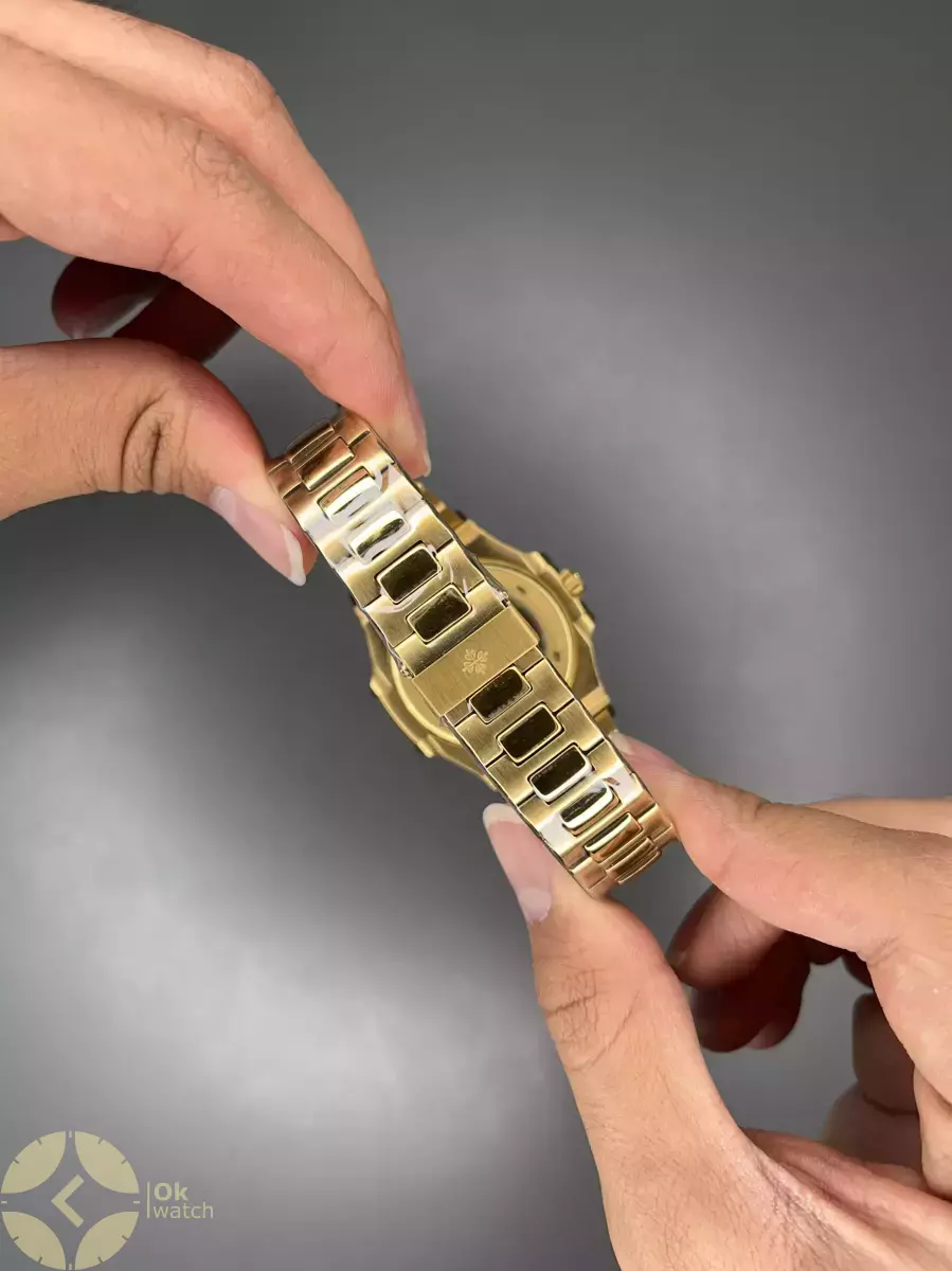 ساعت مچی پتک فیلیپ اتوماتیک بند طلایی صفحه مشکی Patek Philippe Nautilus