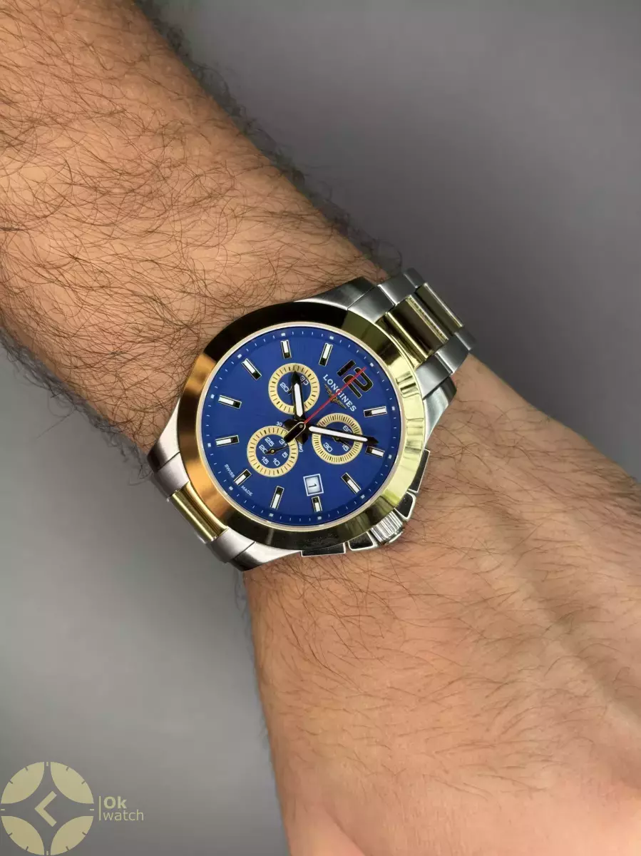 ساعت مچی لونژین کورنوگراف صفحه سرمه ای بند سیلور طلایی Longines